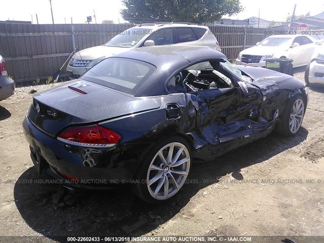 WBALM7C57BE383245 - 2011 BMW Z4 SDRIVE35I შავი ფოტო 4