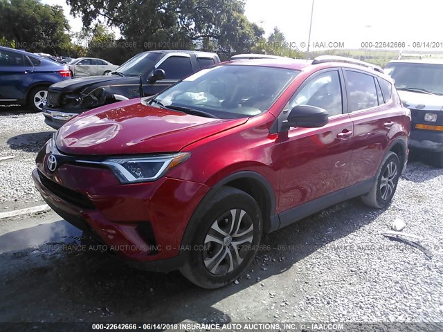 2T3ZFREV9GW262202 - 2016 TOYOTA RAV4 LE RED photo 2