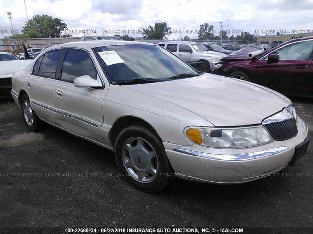 1LNHM97V3XY693747 - 1999 LINCOLN CONTINENTAL  CREAM photo 1