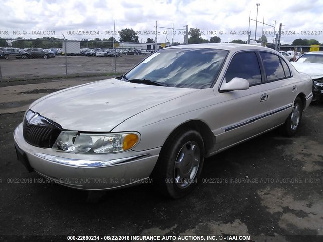 1LNHM97V3XY693747 - 1999 LINCOLN CONTINENTAL  CREAM photo 2