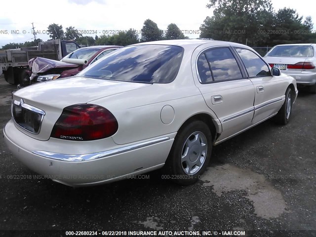 1LNHM97V3XY693747 - 1999 LINCOLN CONTINENTAL  CREAM photo 4