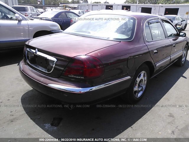 1LNHM97V1YY811750 - 2000 LINCOLN CONTINENTAL  Rot Foto 4