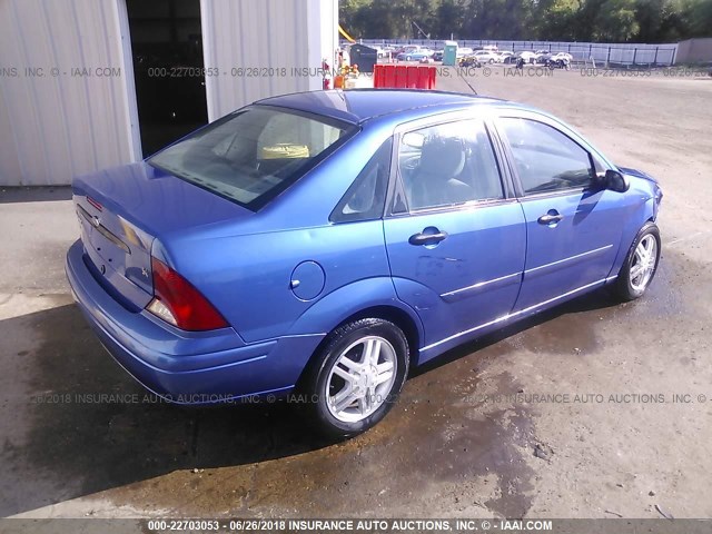 1FAFP34303W209709 - 2003 FORD FOCUS SE COMFORT/SE SPORT BLUE photo 4