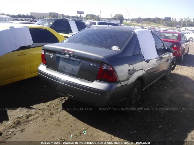 1FAFP34N35W276499 - 2005 FORD FOCUS ZX4 GRAY photo 4