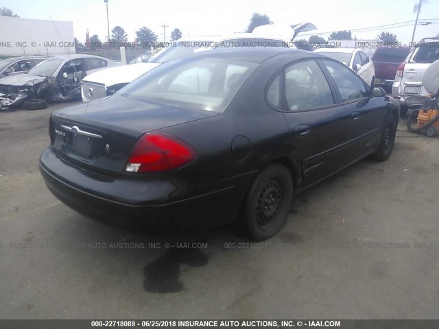 1FAFP52UX3A244858 - 2003 FORD TAURUS LX BLACK photo 4