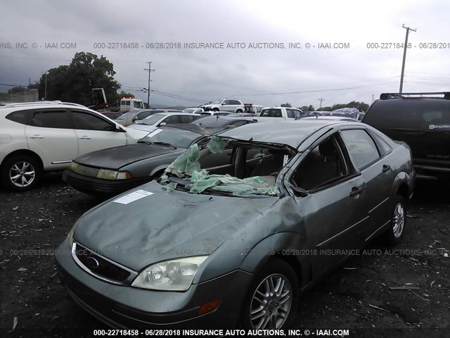 1FAFP34N55W230088 - 2005 FORD FOCUS ZX4 GREEN photo 2