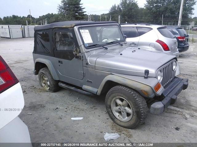 1J4FA29P9YP729811 - 2000 JEEP WRANGLER / TJ SE SILVER photo 1