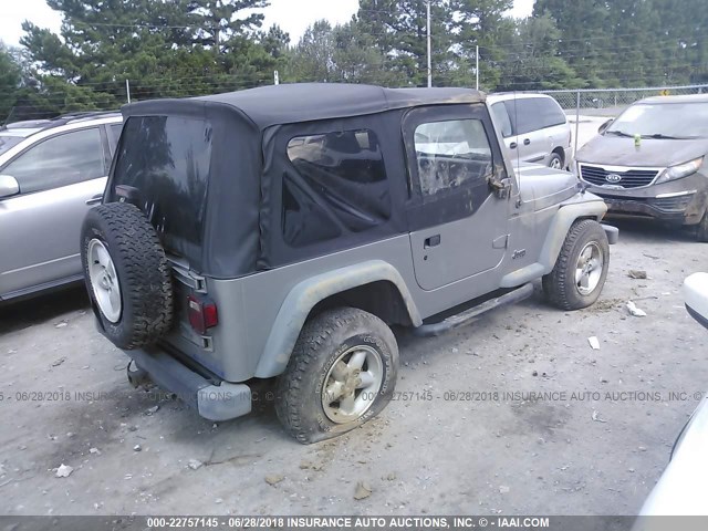 1J4FA29P9YP729811 - 2000 JEEP WRANGLER / TJ SE SILVER photo 4