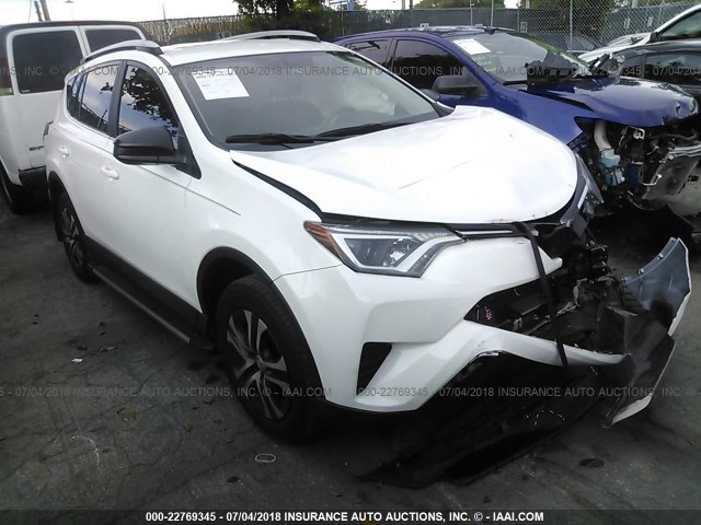 2T3ZFREV8GW304150 - 2016 TOYOTA RAV4 LE WHITE photo 1