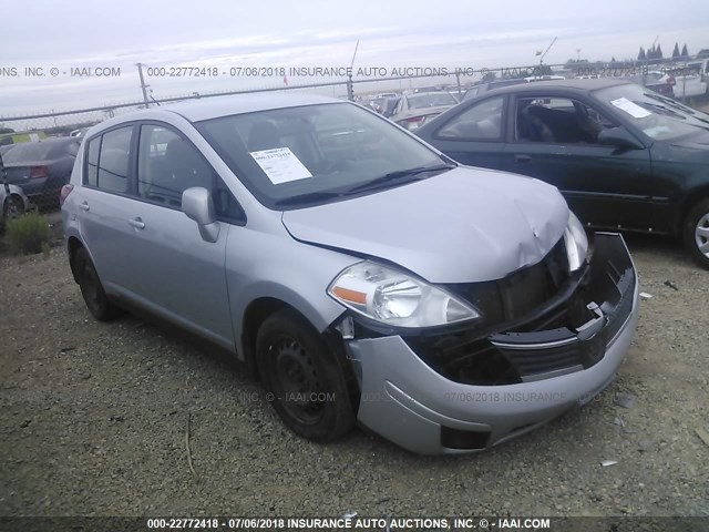 3N1BC13EX9L436239 - 2009 NISSAN VERSA S/SL SILVER photo 1