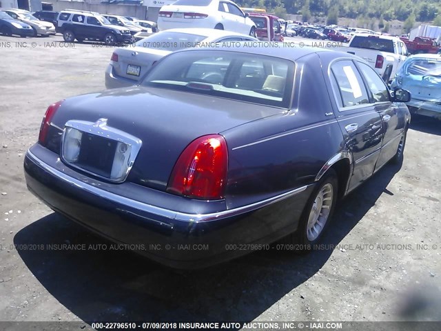 1LNHM81W4XY694210 - 1999 LINCOLN TOWN CAR EXECUTIVE BLUE photo 4