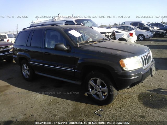 1J8GW68J14C204364 - 2004 JEEP GRAND CHEROKEE OVERLAND GRAY photo 1