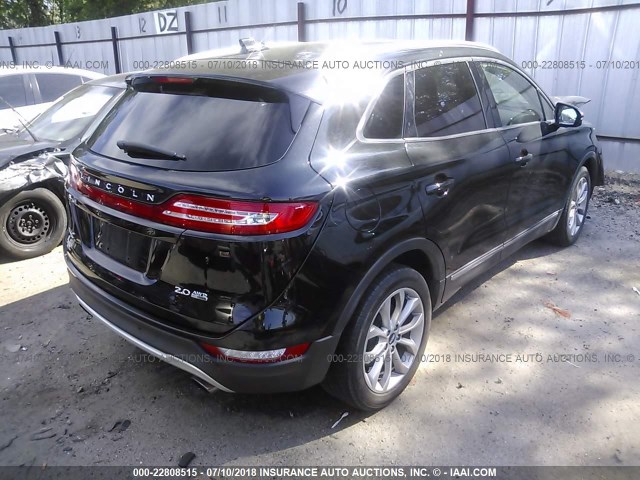 5LMCJ2A95FUJ19028 - 2015 LINCOLN MKC BLACK photo 4