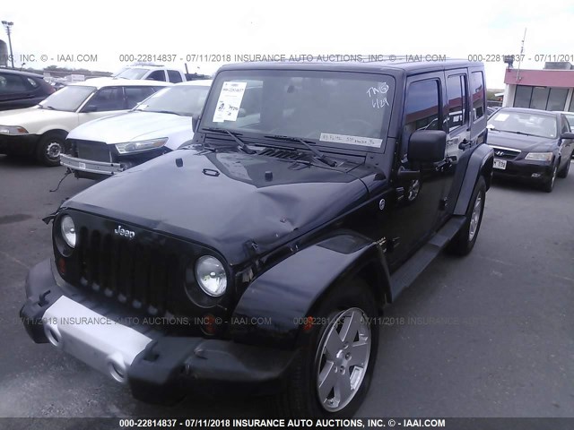 1J4GA59198L586190 - 2008 JEEP WRANGLER UNLIMITE SAHARA BLACK photo 2