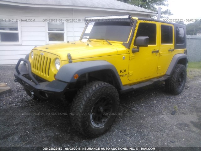 1J4GA391X9L765845 - 2009 JEEP WRANGLER UNLIMITE X YELLOW photo 2