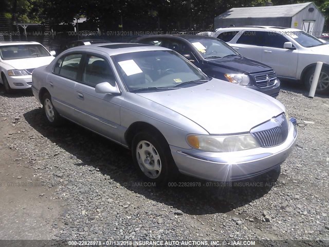 1LNHM97V4XY675127 - 1999 LINCOLN CONTINENTAL  SILVER photo 1