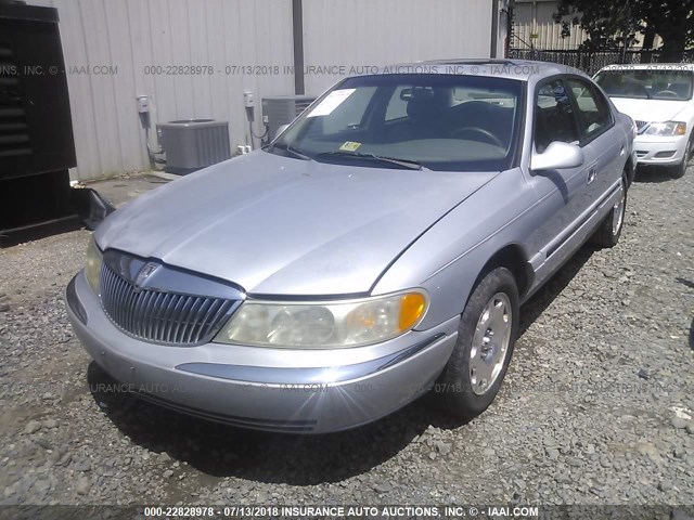 1LNHM97V4XY675127 - 1999 LINCOLN CONTINENTAL  SILVER photo 2