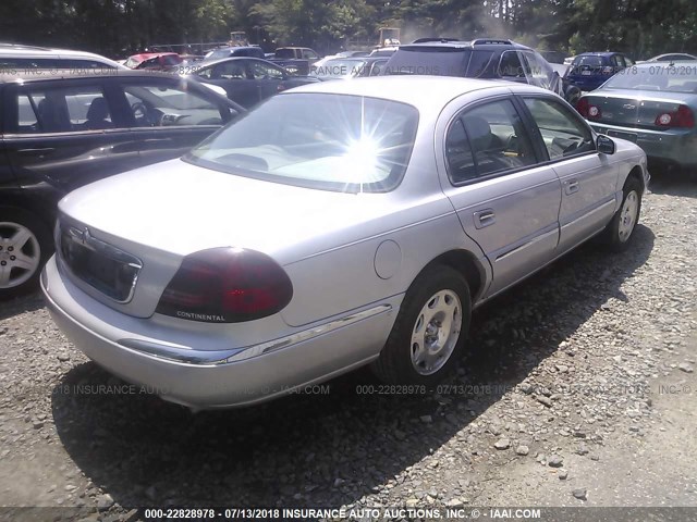 1LNHM97V4XY675127 - 1999 LINCOLN CONTINENTAL  SILVER photo 4