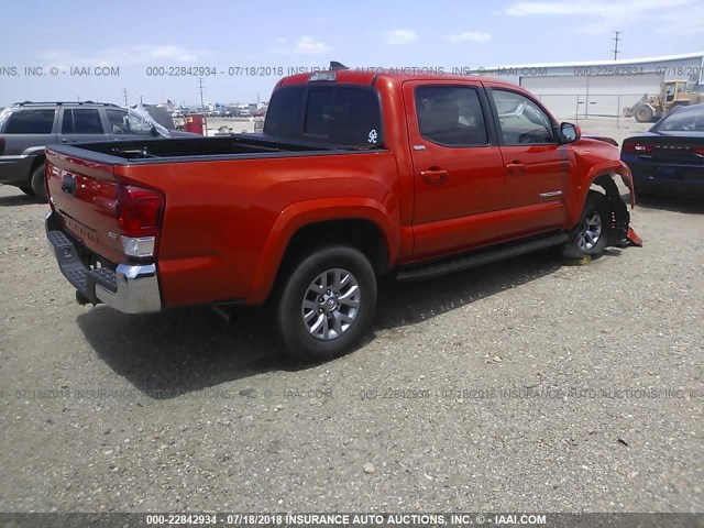 5TFCZ5AN4GX042456 - 2016 TOYOTA TACOMA DBL CAB/SR/SR5/TRD SPT/OR ORANGE photo 4