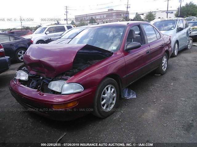 1Y1SK5287SZ034241 - 1995 GEO PRIZM LSI RED photo 2