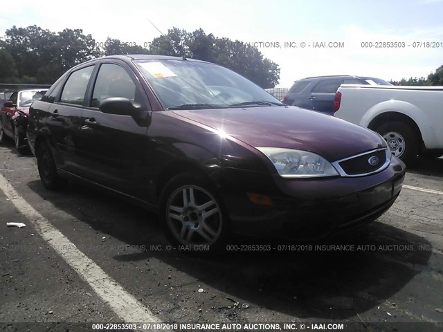 1FAFP34N06W160937 - 2006 FORD FOCUS ZX4 RED photo 1