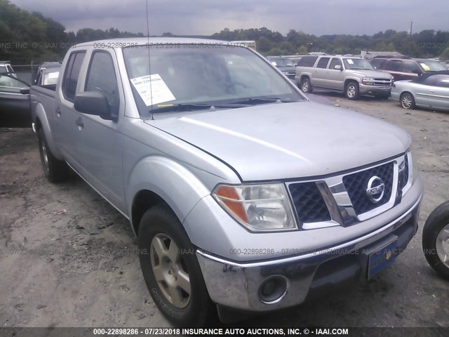 1N6AD09UX7C457225 - 2007 NISSAN FRONTIER CREW CAB LE/SE/OFF ROAD SILVER photo 1