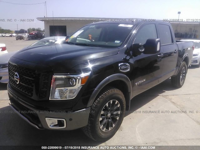 1N6AA1E57HN566146 - 2017 NISSAN TITAN SV/SL/PRO-4X/PLAT RES BLACK photo 2