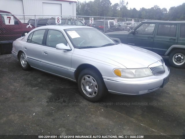 1LNHM97V2XY644085 - 1999 LINCOLN CONTINENTAL  Srebrny zdjęcie 1