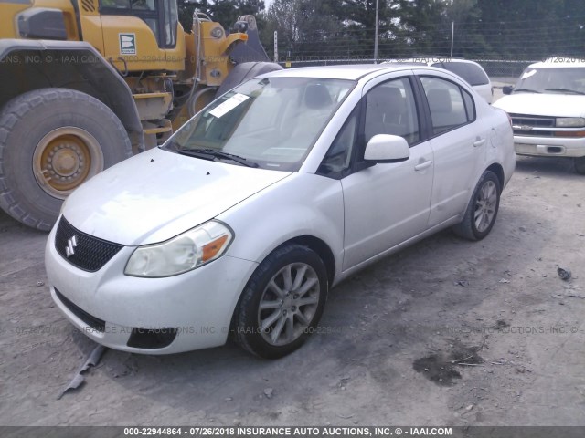 JS2YC5A27B6303712 - 2011 SUZUKI SX4 LE WHITE photo 2