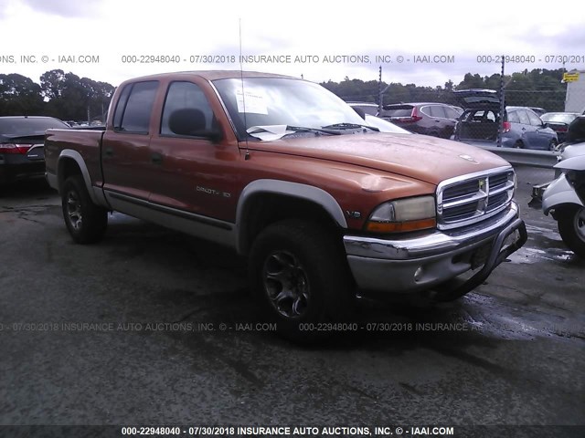 1B7GG2AN1YS619285 - 2000 DODGE DAKOTA QUAD ORANGE photo 1