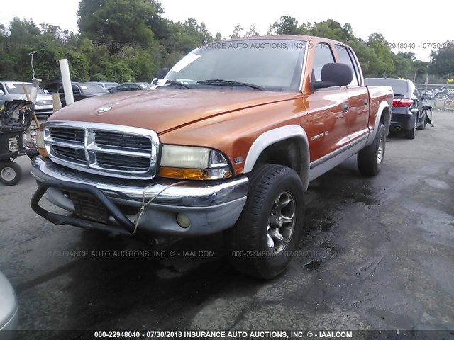 1B7GG2AN1YS619285 - 2000 DODGE DAKOTA QUAD ORANGE photo 2