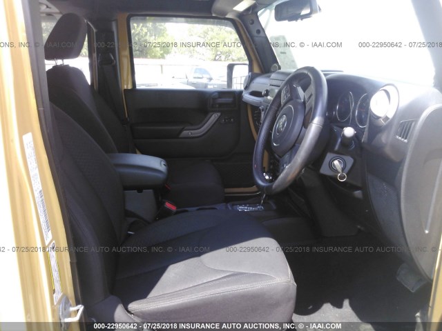 1C4BJWKG5DL672563 - 2013 JEEP WRANGLER UNLIMITE SPORT YELLOW photo 5