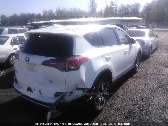 2T3RFREV7JW786231 - 2018 TOYOTA RAV4 ADVENTURE/XLE WHITE photo 4
