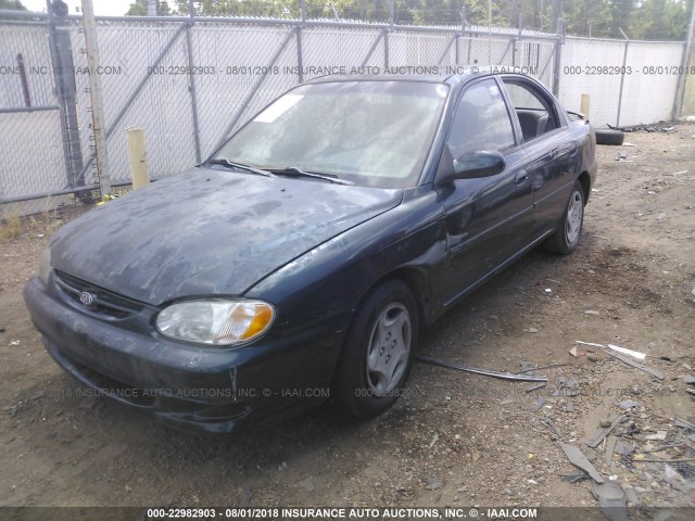 KNAFB121015054741 - 2001 KIA SEPHIA LS GREEN photo 2