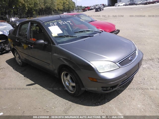 1FAHP34NX7W342655 - 2007 FORD FOCUS ZX4/S/SE/SES GRAY photo 1