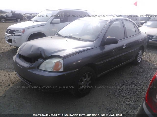 KNADC125936213583 - 2003 KIA RIO GRAY photo 2