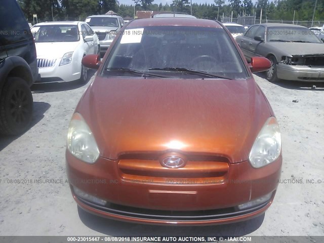 KMHCN36C19U133904 - 2009 HYUNDAI ACCENT SE ORANGE photo 6