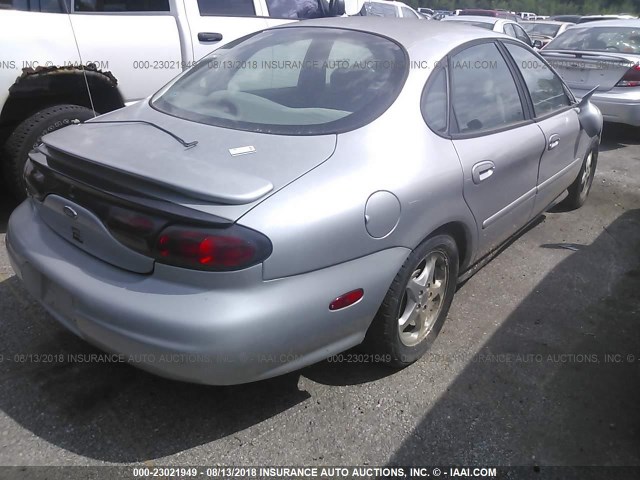 1FAFP53S7XG219593 - 1999 FORD TAURUS SE/COMFORT/SPORT GRAY photo 4