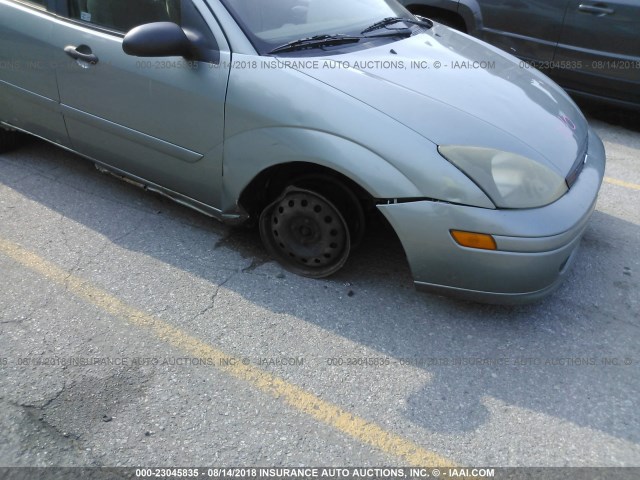 1FAFP34314W155807 - 2004 FORD FOCUS SE COMFORT/SE SPORT Light Blue photo 6