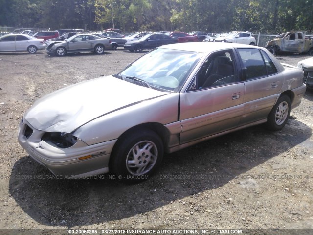 1G2NE52T2VC760744 - 1997 PONTIAC GRAND AM SE GOLD photo 2