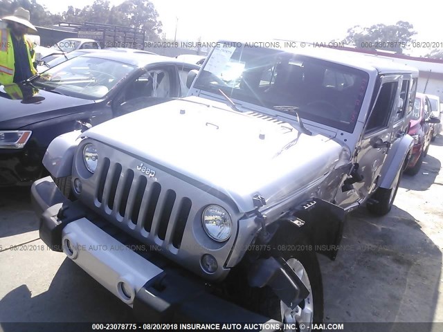 1C4HJWEG9EL186734 - 2014 JEEP WRANGLER UNLIMITE SAHARA SILVER photo 2