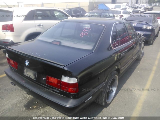 WBAHE6316RGF25788 - 1994 BMW 540 I AUTOMATIC BLACK photo 4