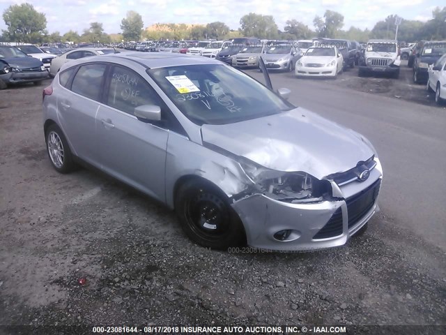 1FAHP3N21CL129917 - 2012 FORD FOCUS TITANIUM SILVER photo 1