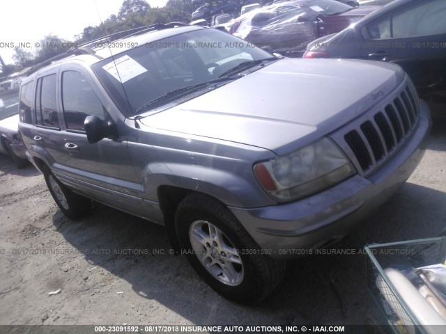 1J4GW58NXYC158067 - 2000 JEEP GRAND CHEROKEE LIMITED SILVER photo 1