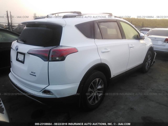 JTMRJREV9GD008663 - 2016 TOYOTA RAV4 HV XLE WHITE photo 4