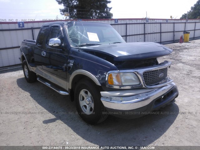 1FTRX07W9XKA02308 - 1999 FORD F150 Синий фото 1