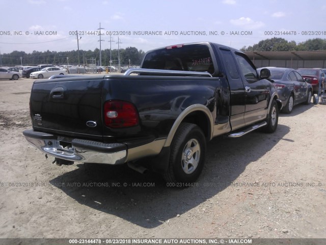 1FTRX07W9XKA02308 - 1999 FORD F150 Синий фото 4