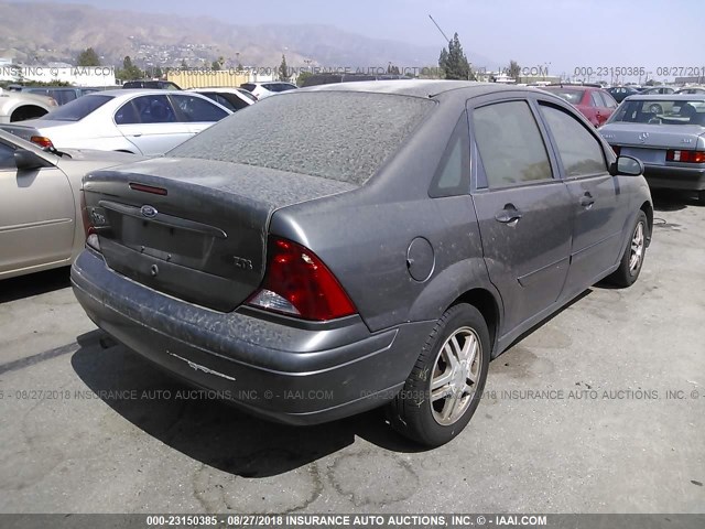 1FAFP38Z84W107932 - 2004 FORD FOCUS ZTS GRAY photo 4