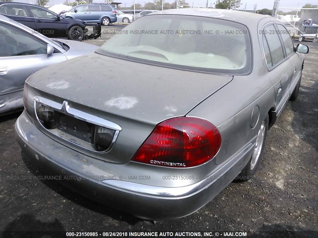 1LNHM97V2YY925241 - 2000 LINCOLN CONTINENTAL  Silber Foto 4