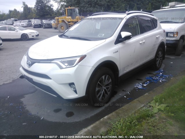 JTMRJREV8GD030671 - 2016 TOYOTA RAV4 HV XLE WHITE photo 2